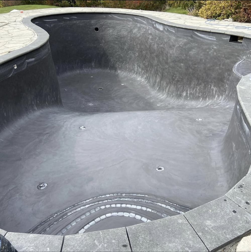 Same pool with a new grey marbelite finish and step tile